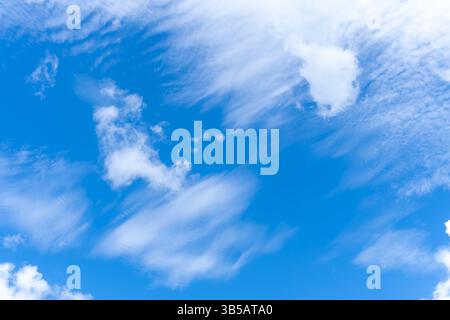 Low angle view and full frame of beautiful blue sky with strange shape of thin white clouds in the morning or afternoon  on sunny day Stock Photo