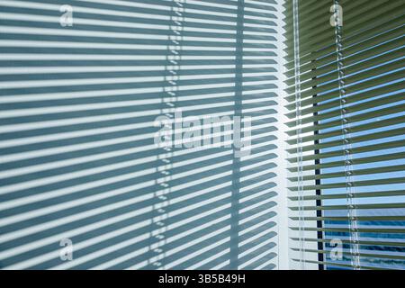 Miami Beach Florida,window blinds,indoor wall,abstract light pattern,shadow design,stripes geometry,line pattern,interior window detail,sunlight throu Stock Photo