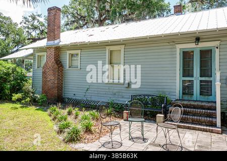 Orlando Florida,College Park,Clouser Avenue,Jack Kerouac House,outside exterior,backyard rear patio,wooden historic home,metal roof,blue double doors, Stock Photo
