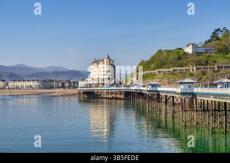 Llandudno Pier, The Grand Hotel and the seafront hotels, with Snowdonia in the background. After significant damage during Storm Darragh on December 7 Stock Photo