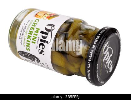 Opies mini gherkins pickled in spirit vinegar in a 227g glass jar Stock Photo
