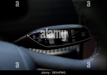 Close up view of car light switch control. Headlight switch, turn signal lever, and fog light switch Stock Photo