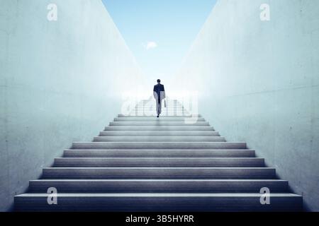 Ambitions concept with businessman climbing stairs Stock Photo