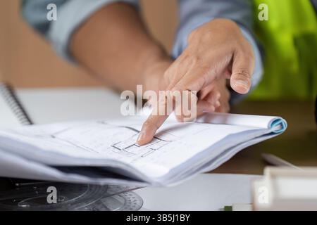 Green tech detailed discussion on sustainable project plans Stock Photo