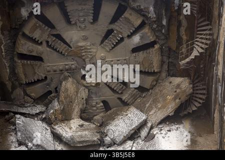 Tunnel Boring Machine front head element is seen on a subway station under construction Stock Photo