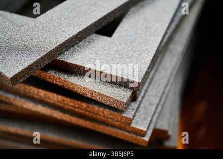 Crafting foam frames for decorative gift boxes and cardboard packaging projects in a cozy workshop environment on a sunny afternoon Stock Photo
