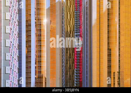 Urban abstract close up view of multiple steel and glass windows facade office building Stock Photo
