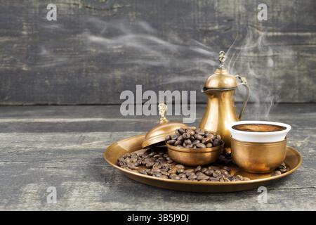 Turkish coffee with traditional copper serving set and coffee beans Stock Photo