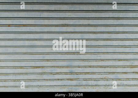 Rusty metal roller shutter garage door texture Stock Photo