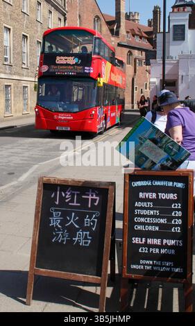 Open top City Sightseeing bus in Cambridge's historic city centre by Queen's College and the River Cam in spring. UK Stock Photo