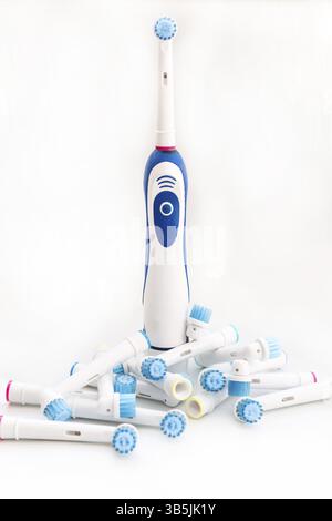 Electronic toothbrush with toothbrush heads isolated on a white background Stock Photo