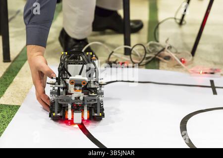 Open competition of self-made robots among school students. A robot made of Lego blocks Stock Photo