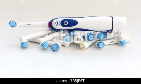 Electronic toothbrush with toothbrush heads isolated on a white background Stock Photo