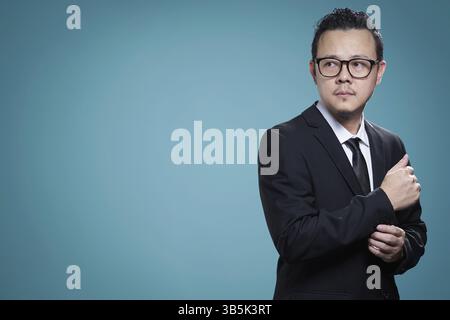 Portrait of motivated asian businessman Stock Photo