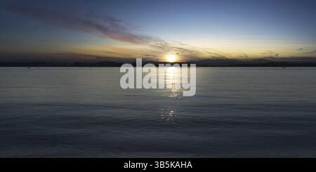 Tranquil seascape with sunset sky. Panorama big field view background Stock Photo