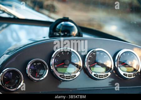 Motor yacht control panel. Gauges, speedometers and control buttons. Stock Photo