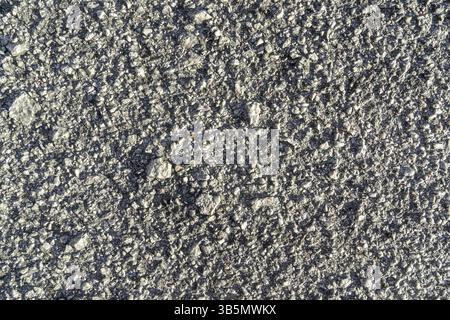 Close up surface rough of asphalt, Seamless grey road with small rock, Texture Background Stock Photo