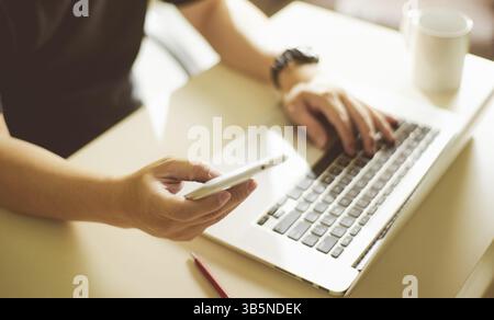 Young sman hand using smart phone, mobile payments online shopping.Seleted focus Stock Photo