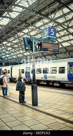 Waiting for the Blackpool bound Northern Rail train from Liverpool Lime street station Stock Photo