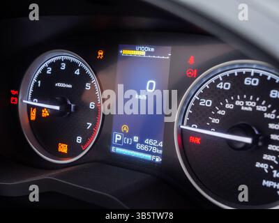 Warning lights illuminating car dashboard, gauges displaying zero speed and critical vehicle information Stock Photo