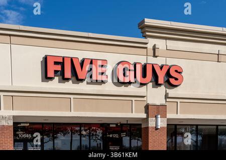 Closeup of Five Guys restaurant sign on the building. Pearland, Texas, USA Stock Photo