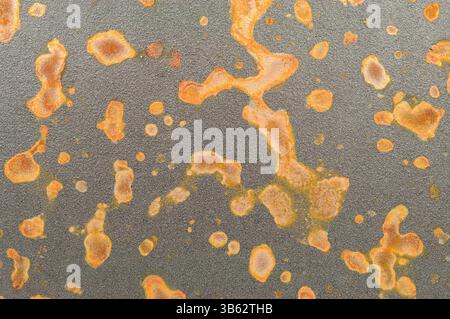 Rusty speckled cast iron metal corrosion background texture Stock Photo