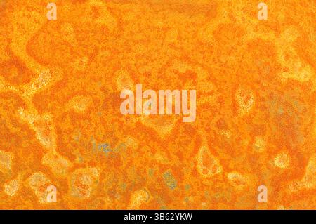 Light rust covered metal sheet corrosion pattern background texture Stock Photo