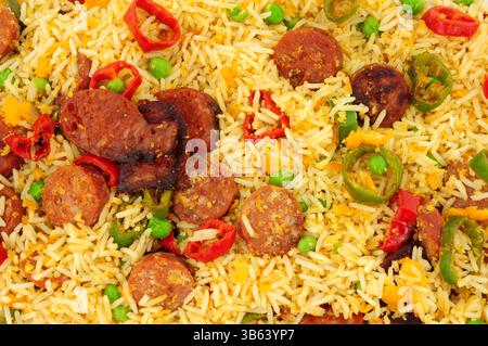 Egg fried rice with spicy chorizo salami and Chilli peppers background Stock Photo