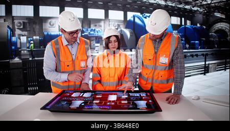 Electricity Generation In Power Plant Controlled By Man Using SCADA. Stock Photo