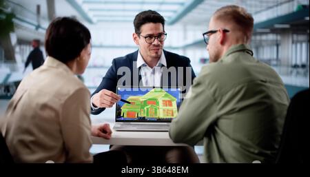 Professional House Inspector Using Heat Thermography On Laptop For Assessment. Stock Photo