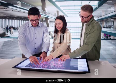Hispanic Engineer Uses Computer To Analyze Big Data In Factory. Stock Photo