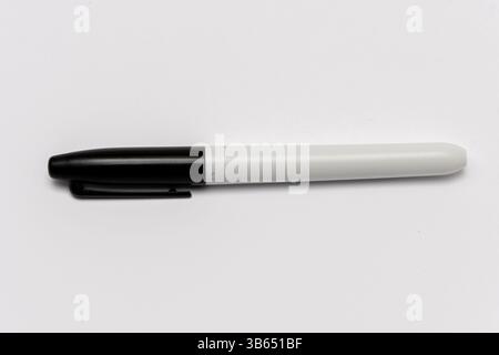 A plain black marker for writing and drawing, isolated on a white background Stock Photo