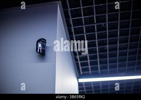 surveillance camera in a stylish technical office and at home. Safety and reliability Stock Photo