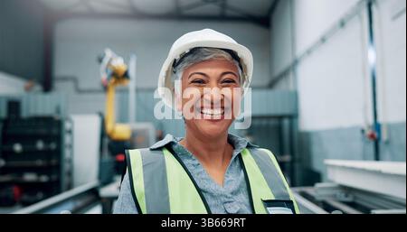 Portrait, woman and engineer with smile for robotics production, manufacturing career and industry. Happy, mature person and technician with pride for Stock Photo
