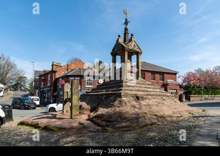 Lymm Cross in the centre of the village of Lymm near Warrington, Cheshire, England. Stock Photo