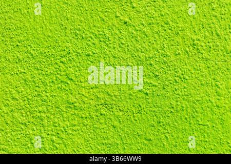 Bright lime green textured wall surface. Stock Photo