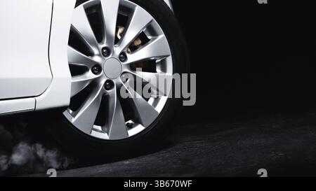 Luxury Metallic Car Wheel, Close-up of a alloy wheel with tire of car on black background. Stock Photo