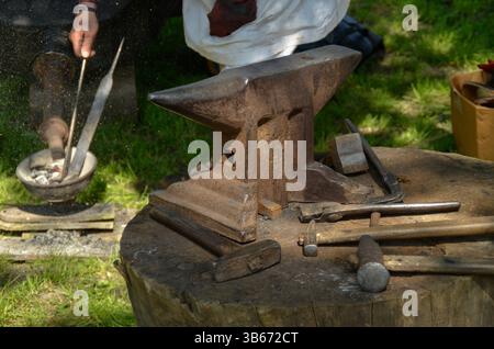 ancient blacksmithing historical reenactment, iron age, sparks hot iron Stock Photo