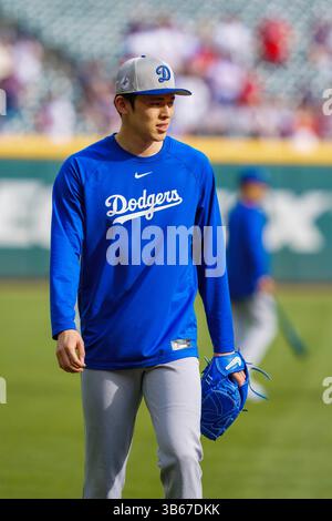 Los Angeles Dodgers pitcher Roki Sasaki runs in the team's campsite in ...