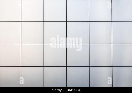 A view of a wall facade of reflective metallic squares. Stock Photo