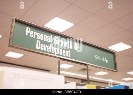 A view of a genre sign at a bookstore that says Personal Growth and Development. Stock Photo