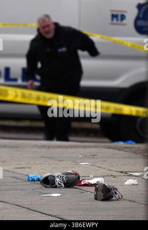 December 21, 2023, Washington, District of Columbia, USA: A quadruple shooting left two dead and two critically wounded at the Friendly Food corner market near Nationals Park. Trish Harris, 35, died at the scene and leaves behind three children just days before the Christmas holiday. Also killed was Tyrone Jacobs, 24, whose son will turn 5 on New Year's Eve. It is suspected a vehicle that had been carjacked was used in the killing. It was later found torched. Dozens of shell casings littered the road and sidewalk, and large bullet holes tore through a mural on the wall of the market after the Stock Photo