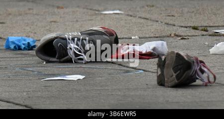 December 21, 2023, Washington, District of Columbia, USA: A quadruple shooting left two dead and two critically wounded at the Friendly Food corner market near Nationals Park. Trish Harris, 35, died at the scene and leaves behind three children just days before the Christmas holiday. Also killed was Tyrone Jacobs, 24, whose son will turn 5 on New Year's Eve. It is suspected a vehicle that had been carjacked was used in the killing. It was later found torched. Dozens of shell casings littered the road and sidewalk, and large bullet holes tore through a mural on the wall of the market after the Stock Photo