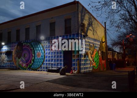 December 21, 2023, Washington, District of Columbia, USA: A quadruple shooting left two dead and two critically wounded at the Friendly Food corner market near Nationals Park. Trish Harris, 35, died at the scene and leaves behind three children just days before the Christmas holiday. Also killed was Tyrone Jacobs, 24, whose son will turn 5 on New Year's Eve. It is suspected a vehicle that had been carjacked was used in the killing. It was later found torched. Dozens of shell casings littered the road and sidewalk, and large bullet holes tore through a mural on the wall of the market after the Stock Photo