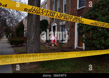 December 21, 2023, Washington, District of Columbia, USA: A quadruple shooting left two dead and two critically wounded at the Friendly Food corner market near Nationals Park. Trish Harris, 35, died at the scene and leaves behind three children just days before the Christmas holiday. Also killed was Tyrone Jacobs, 24, whose son will turn 5 on New Year's Eve. It is suspected a vehicle that had been carjacked was used in the killing. It was later found torched. Dozens of shell casings littered the road and sidewalk, and large bullet holes tore through a mural on the wall of the market after the Stock Photo