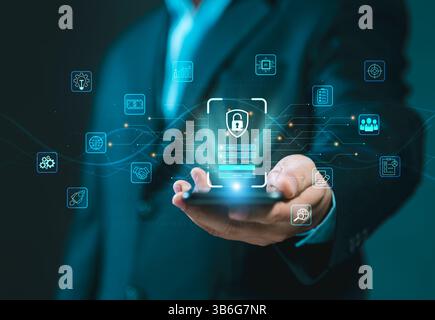 Cybersecurity lock key access and encryption secure access to user's personal information. A businessman using his mobile selects the icon security on Stock Photo