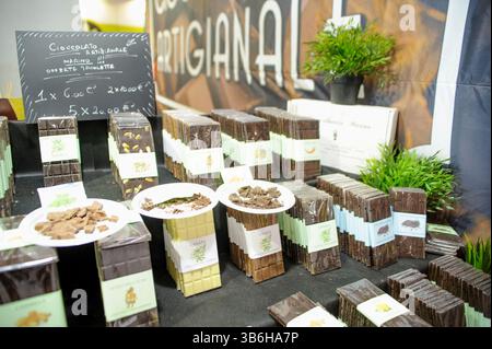 February 23, 2020, Rome, Italy: Hemp chocolate bars and plastic plates with samples displayed during Canapa Mundi, the international hemp fair in Rome. About a month before the start of Canapa Mundi, the International Hemp Fair, which every year attracts professionals in the hemp sector, consumers and enthusiasts of the plant with multiple uses to Rome, after 10 years the organizers announced the stop ''for Force Majeure Reasonsâ€ since the ''recent circumstances have led to a situation of uncertainty''. The organizers report that the main motivation is to protect exhibitors and participants Stock Photo