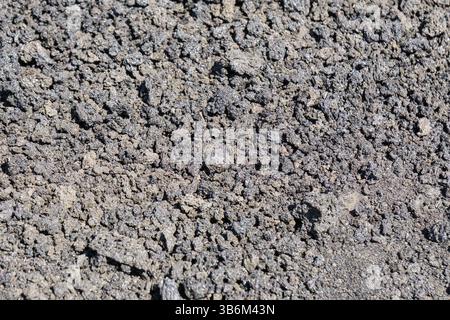 Rough solidified lava rock creating a natural textured background Stock Photo