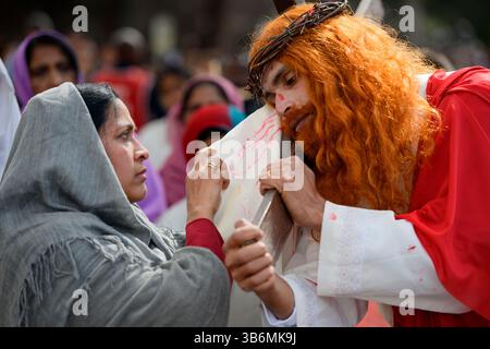April 2, 2023, Rome, Italy: A man impersonating Jesus Christ leaves a bloody imprint of his face on a white cloth during the Stations of the Cross procession organized by the community of Christians originating from the Indian region of Kerala in Rome..Also called ''St. Thomas Christians'', they are a collection of Syriac Christian communities and churches in southwest India, whose origins date back to 52 AD. Among the various communities, the Syro-Malabar Church is the second largest after the Ukrainian Greek-Catholic Church. (Credit Image: © Marcello Valeri/ZUMA Press Wire) Stock Photo