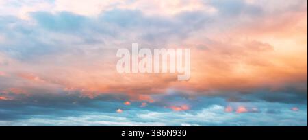 Widescreen Panorama Of The Sunset Sky After The Sun Has Gone Below The Horizon. Only The Sky Above The Horizon. Cirrus Low Clouds. Dramatic Sunset. Stock Photo